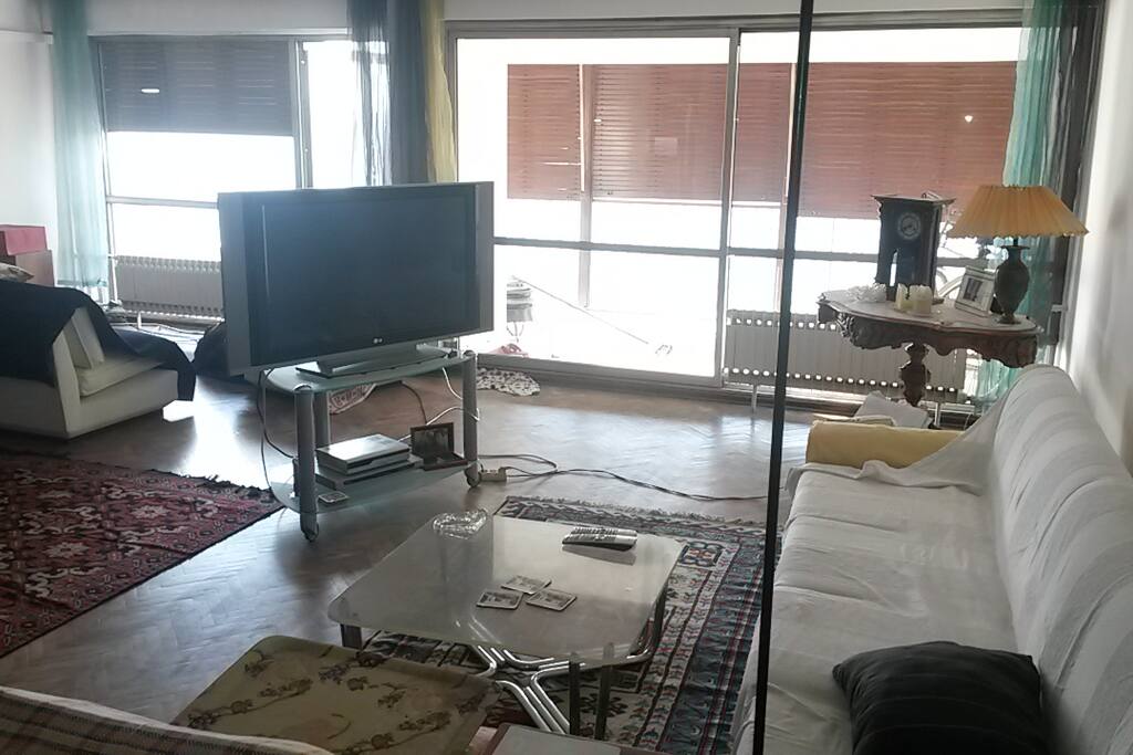 Living room. Time for sunset approaching, so lowered the shades of the patio.