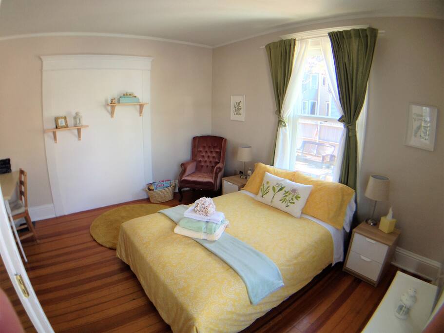 sunny room with full size bed