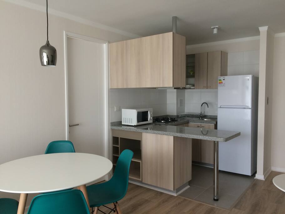 Estar común.Comedor,cocina por cada departamento