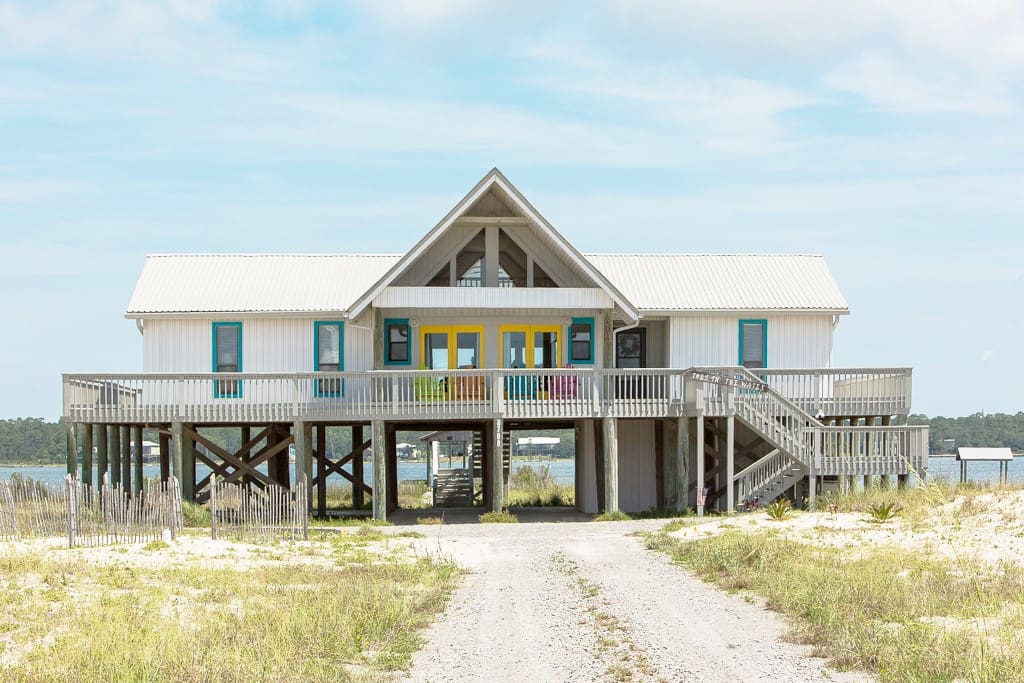 A gorgeous wraparound porch offers lagoon views on one side and gulf views on the other.