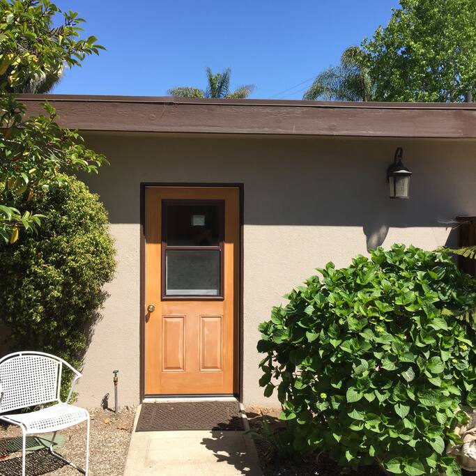 Private guesthouse entrance with enclosed parking