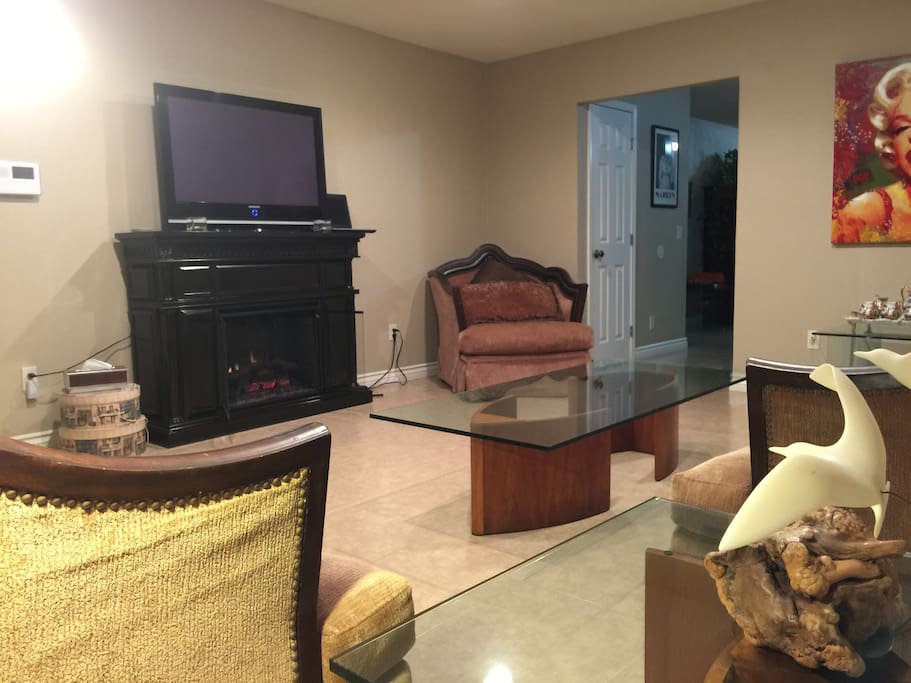 Living room with fire place and flat screen TV