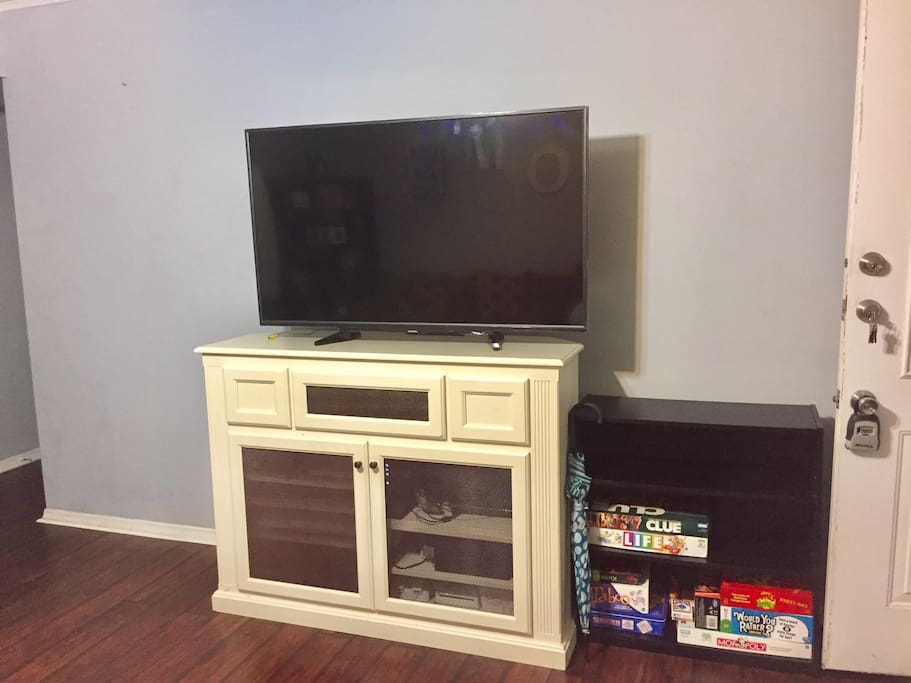 55" TV with access to Amazon Prime and Netflix. There are various board games as well.