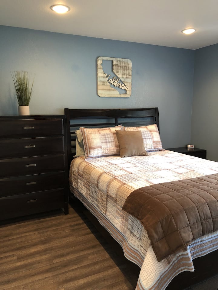 The bedroom features a high quality memory foam queen mattress.
