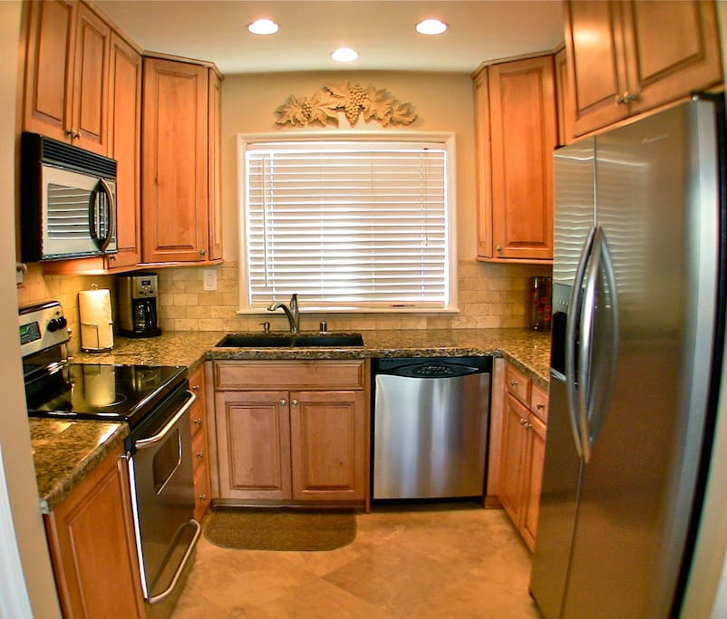 Take a peak of the Pacific in the state-of-the-art kitchen that includes all stainless steel appliances, granite counter tops, microwave, dishwasher, side-by-side refrigerator with water and ice dispenser in the door, and top-of-the-line culinary equipment.