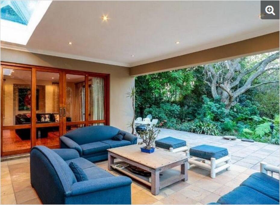 covered veranda overlooking the garden and pool