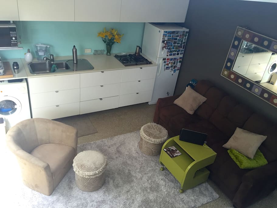 View downstairs from loft. Full kitchen. Washer available.