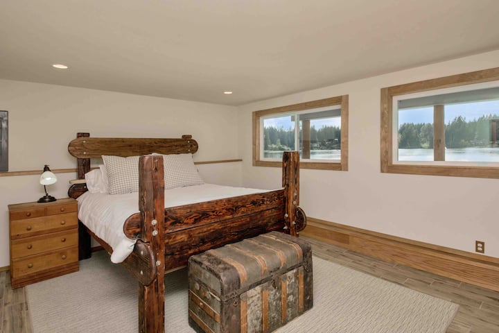 Downstairs bedroom with lake view.
Tall custom built bed frame.