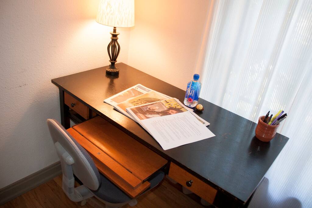 Desk has a pull out tray for your keyboard.