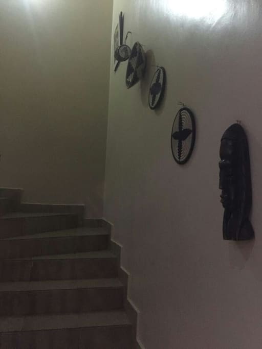 African art lined stairs