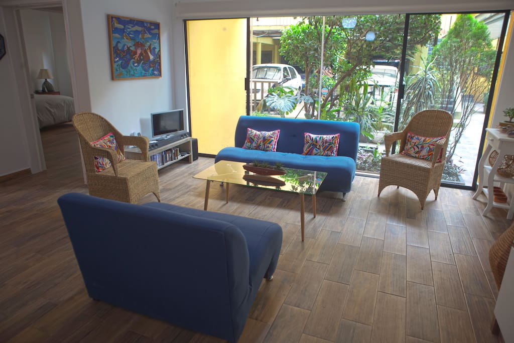 Living room overlooking garden. High-speed internet, Apple TV, complimentary movies for adults and children.