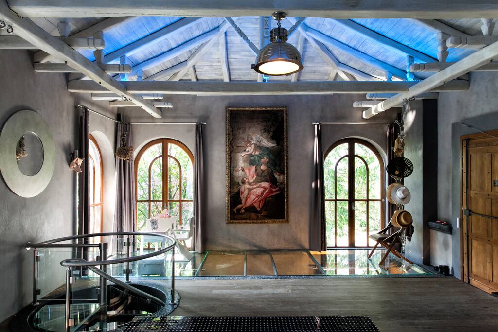 View of living room towards the garden. Original Renaissance painting imposes the space.