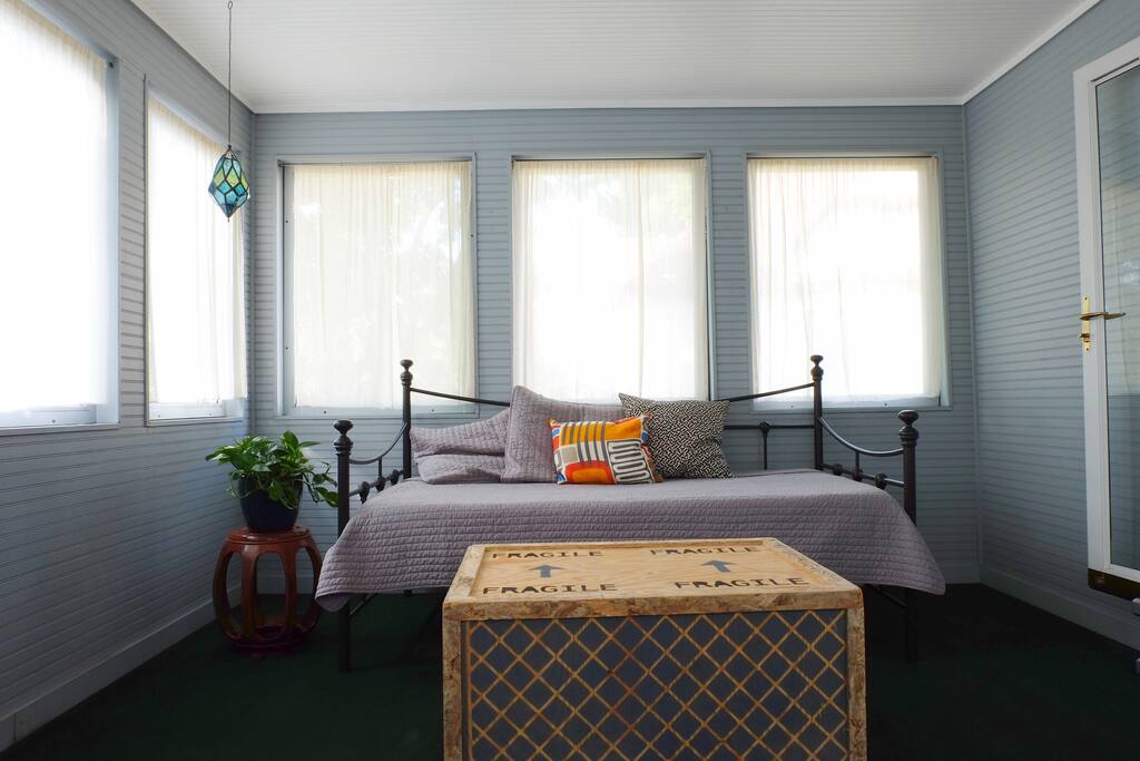 View of the attached screened porch. Perfect for relaxing during nice weather.