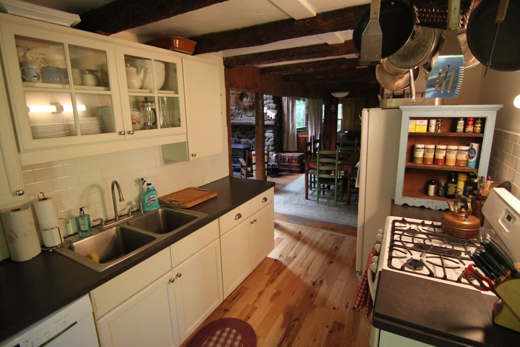 Clean updated kitchen w/ gas stove, Dishwasher, microwave, coffeemaker, toaster over, spices, serving ware, cooking tools, etc