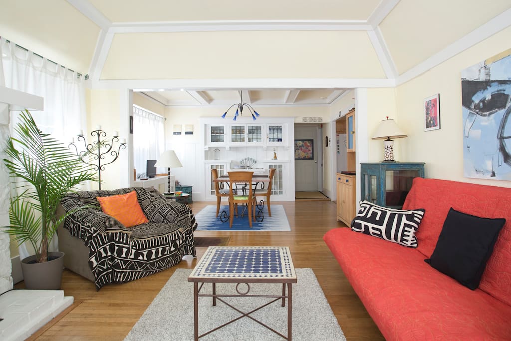 Bright comfortable living and dining room by day. Cozy with warm lighting at night