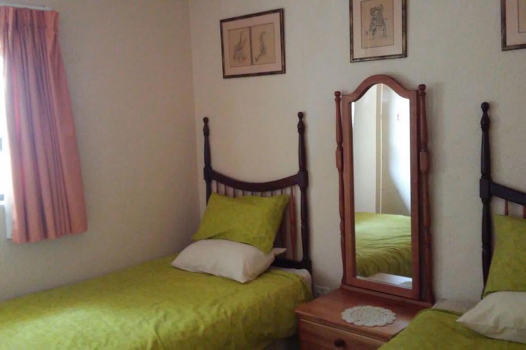 2 x 3/4 beds with one cupboard to hang clothes