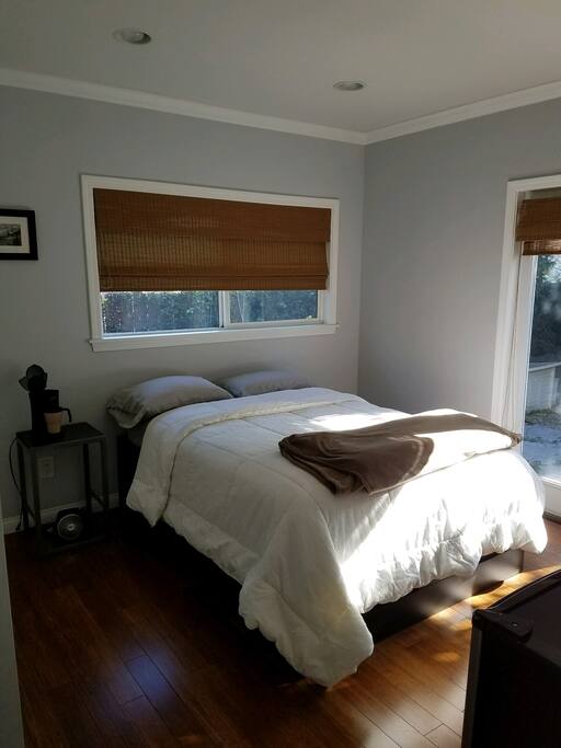This is your bedroom! Access to outside patio. It has a desk, AC, mini fridge, coffee maker, alarm clock and heater.
There is a closet and under bed drawers too!