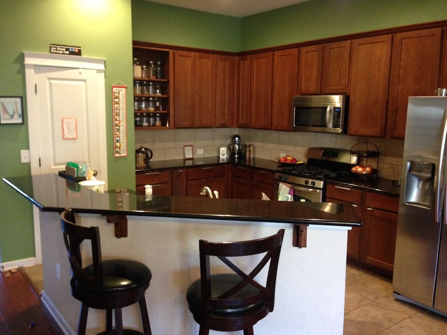 Kitchen opens up to living room and dining area.