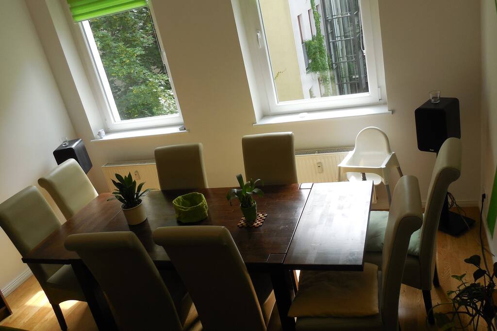 Dinner table in living room with view on 2nd courtyard