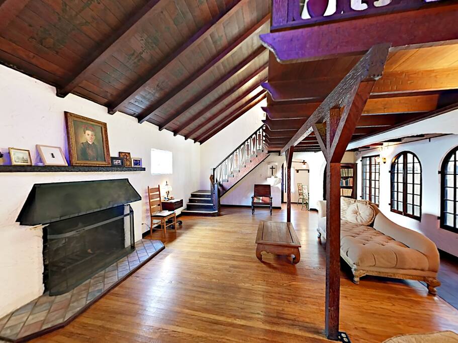 Vaulted ceilings and hardwood floors create a sophisticated vibe in the spacious open living area.