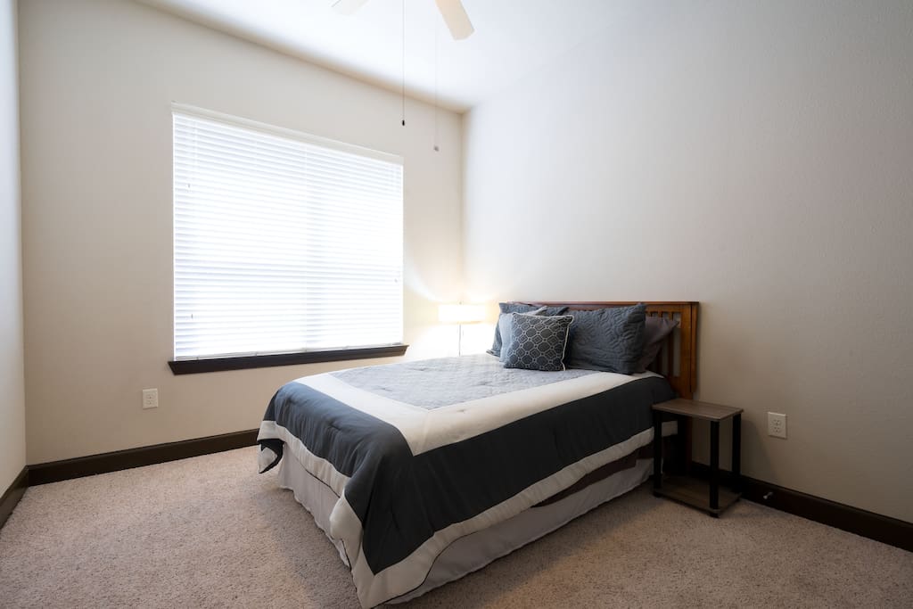 Full size bed in bedroom.