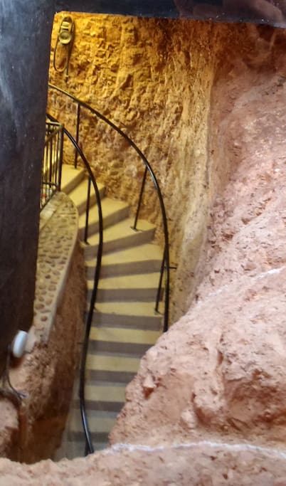 The stairs down to the bedrooms and living areas