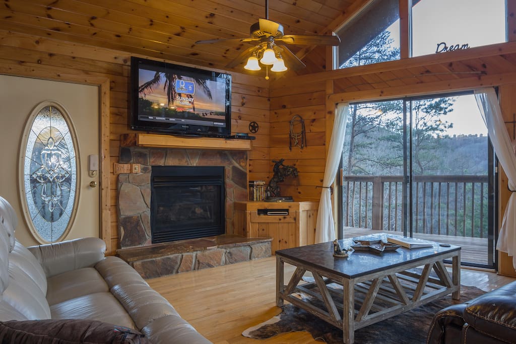 Upstairs Has The Views! There Is 2 Leather Reclining Sofa's, A 50" Flatscreen TV, And A Gas Burning Fireplace (In Season). All TV's In The Cabin Have Direct TV, With The NFL Sunday Ticket Channel.
