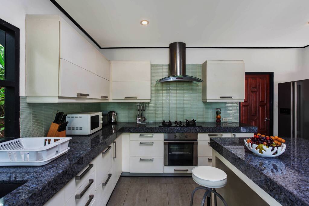 Gourmet Kitchen. Large Fridge, Wine cooler. Large island with stools.