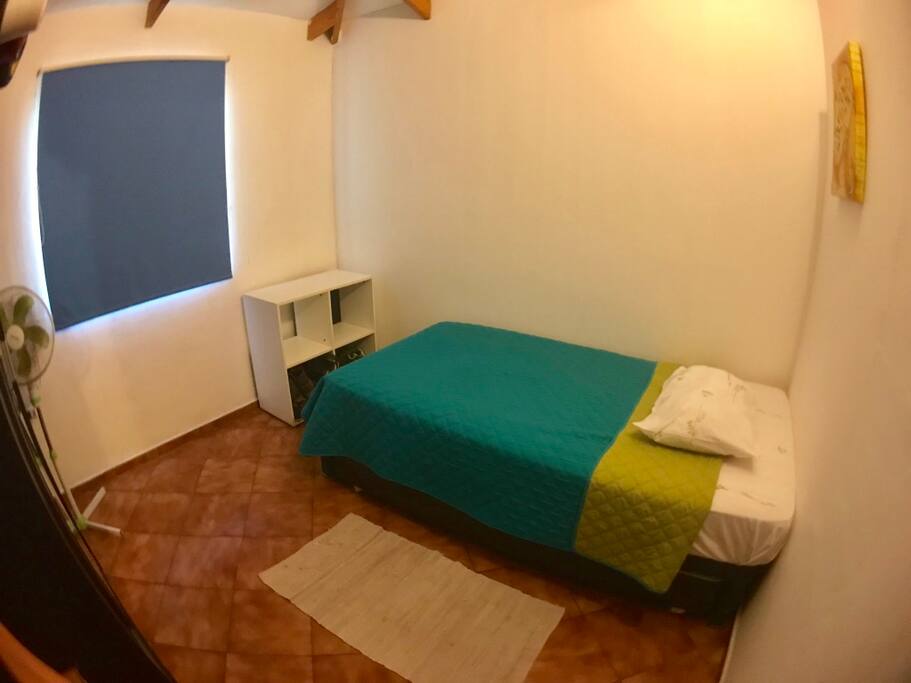 Bedroom 2 with small Closet and fan.