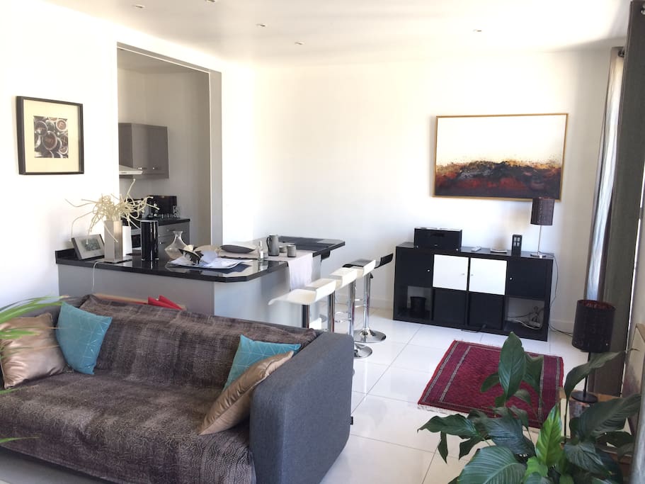The living room and open-table kitchen