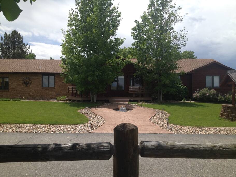 Front of house and entry to living room to immediate stairs to basement