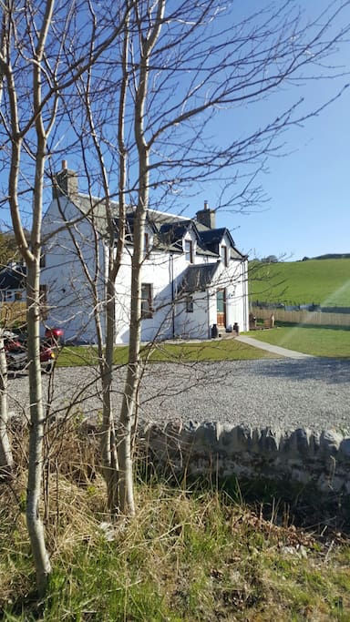 The front of Jacobite Lodge from the bridge over the burn