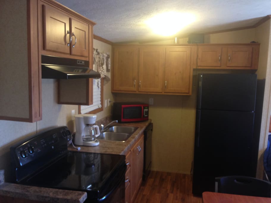 Full Kitchen with Sink, Dishwasher, Range, Refrigerator, Microwave, and Coffee Maker!