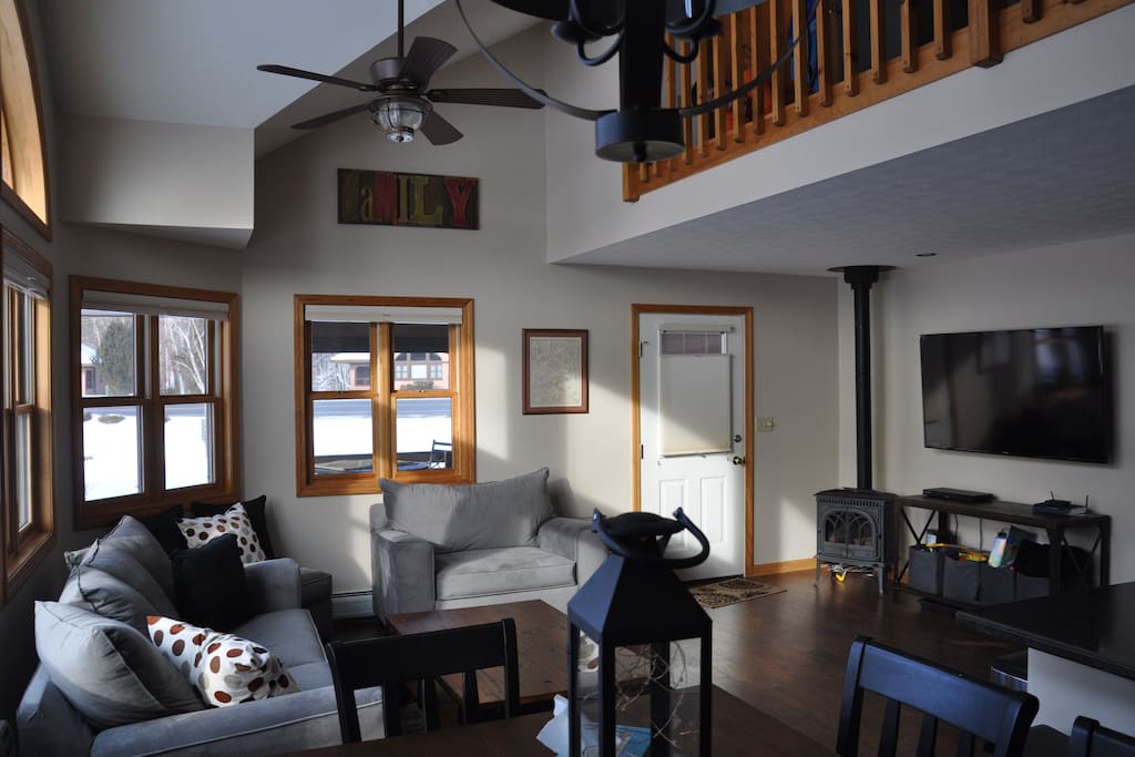 The living room has a gas fireplace (winter use only) and a large 60" TV with cable/DVD/Netflix and is open to the second story loft.