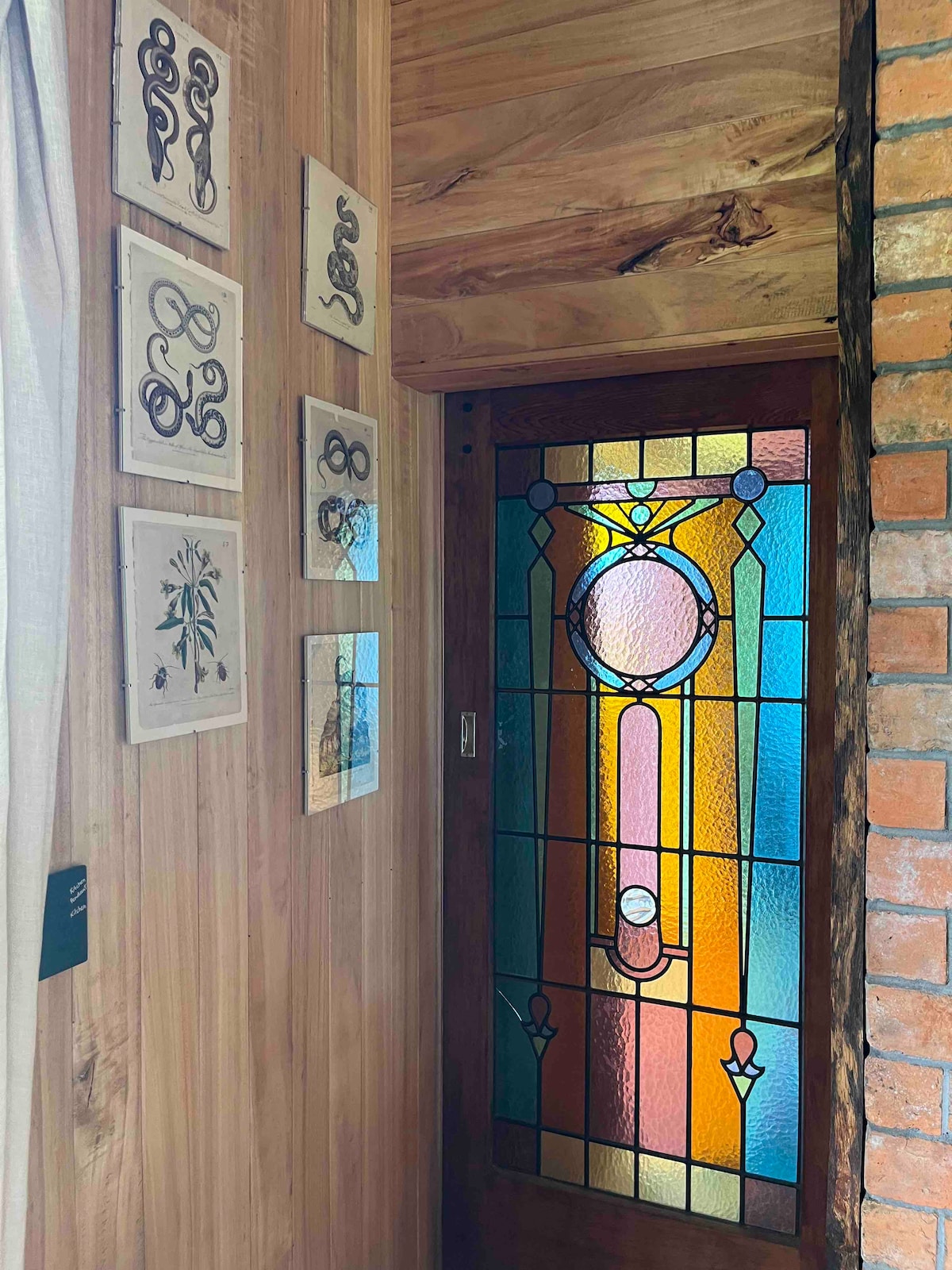Stain glass door leading to main bedroom at New Chums in Whangapoua