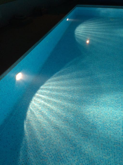 The swimming pool at night time.