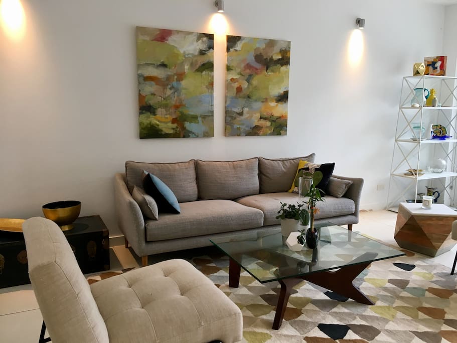 Family room leading through glass doors to sunny courtyard