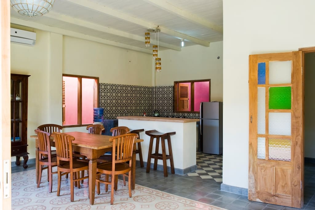 The villa has a nice kitchen with sitting bar and table set