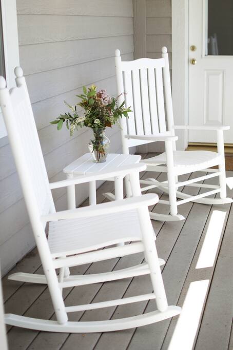 Enjoy a sunny afternoon on the front porch overlooking the Apple Farm.