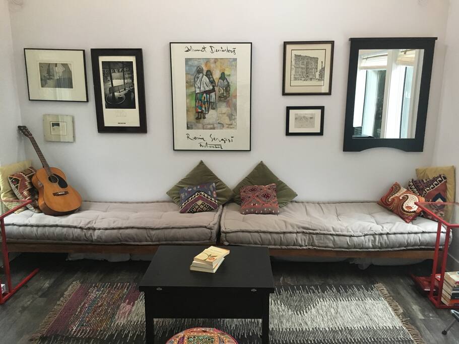 Push the daybeds together for a full-size bed at night