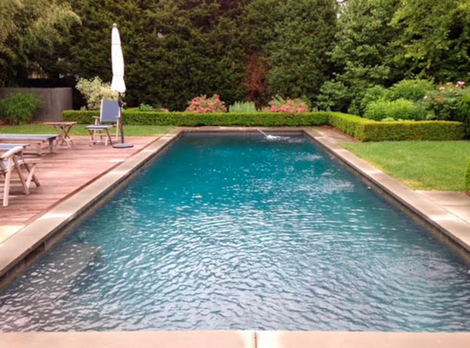 Enjoy a heated, gunite pool surrounded by lush gardens.