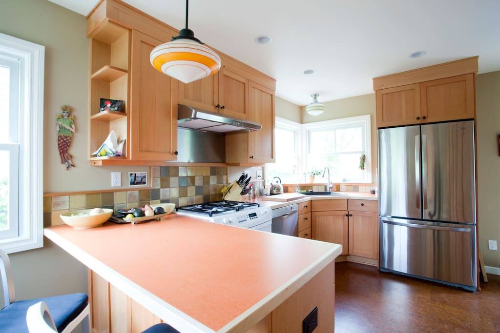 KITCHEN stocked with some basics;culinary herbs, salt and pepper, and cooking utensils, pots and pans, etc.