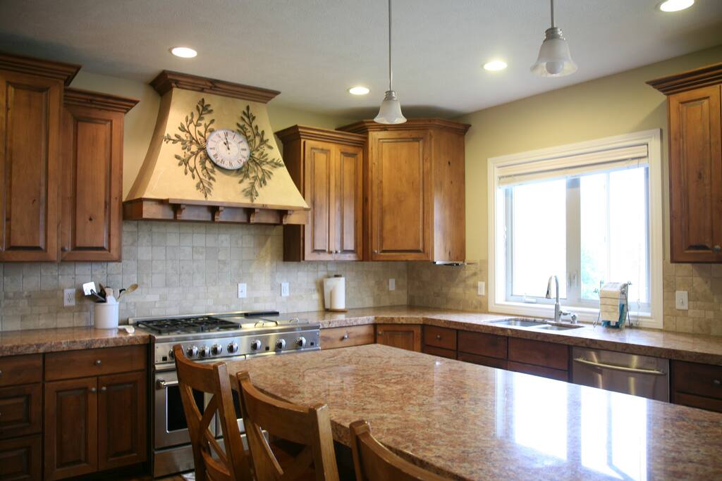 Huge gourmet kitchen with two ovens, grill, and griddle.