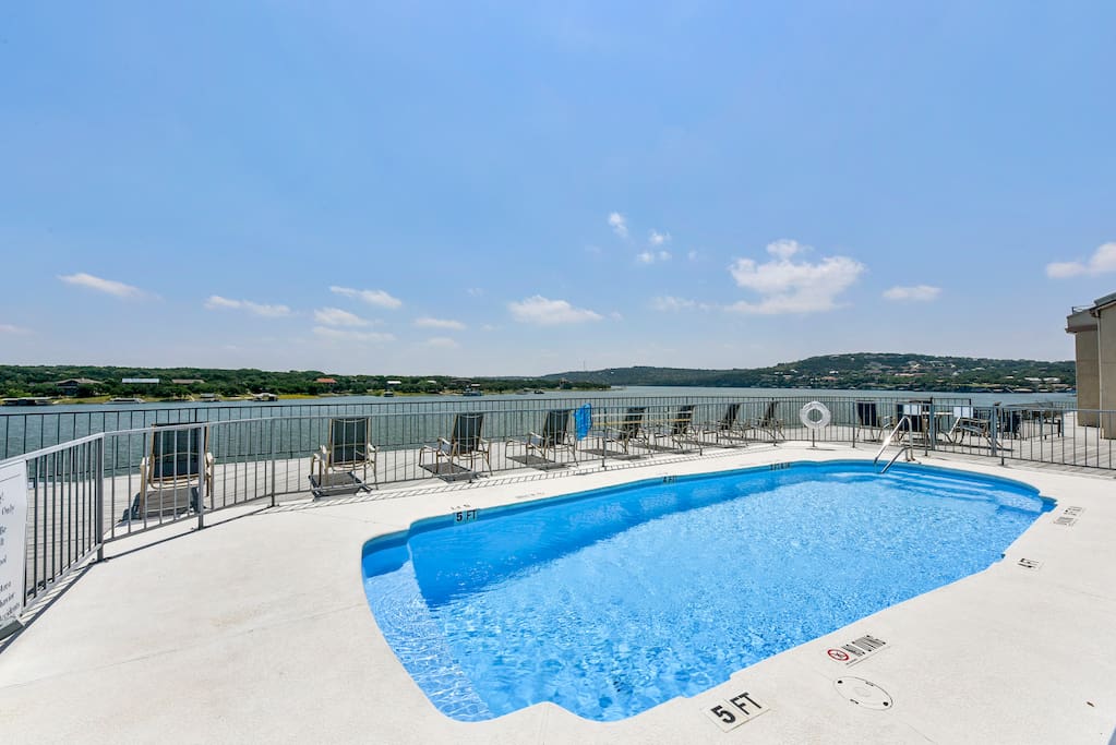 A sparkling swimming pool for your use in the center of this luxury community.