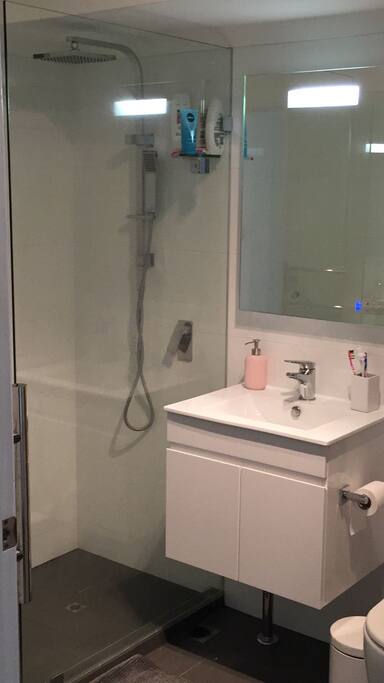 Bathroom two the right you have a door where you can find the washing machine and the dryer.