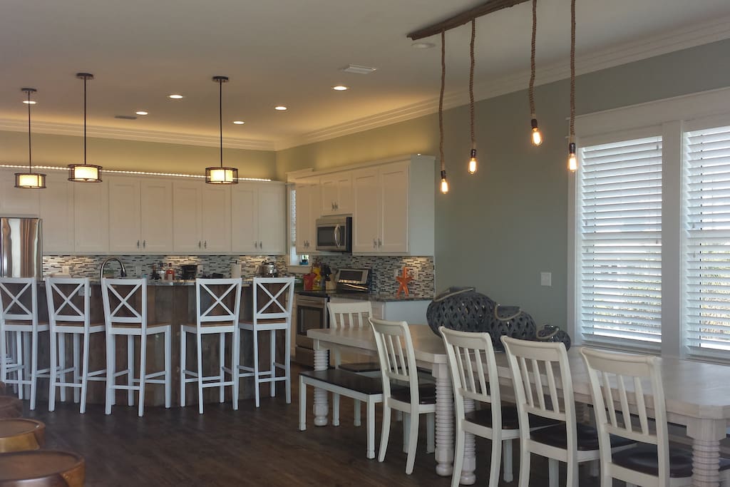 Huge gourmet kitchen, oversized dining table that seats 12-14 and island dining for an additional 7.
