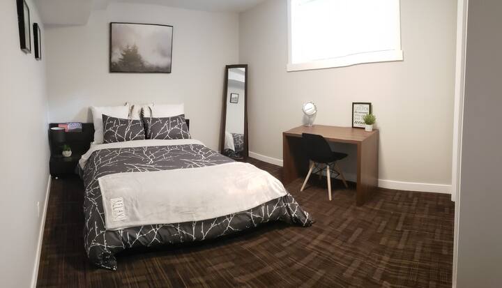 The main bedroom is equipped with a desk and chair for anyone who needs a workstation during their stay.