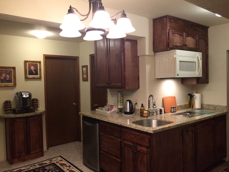 Full Guest Kitchen. Includes refrigerator, microwave, electric cooktop, toaster oven, Keurig coffee maker, hot pot for tea.
