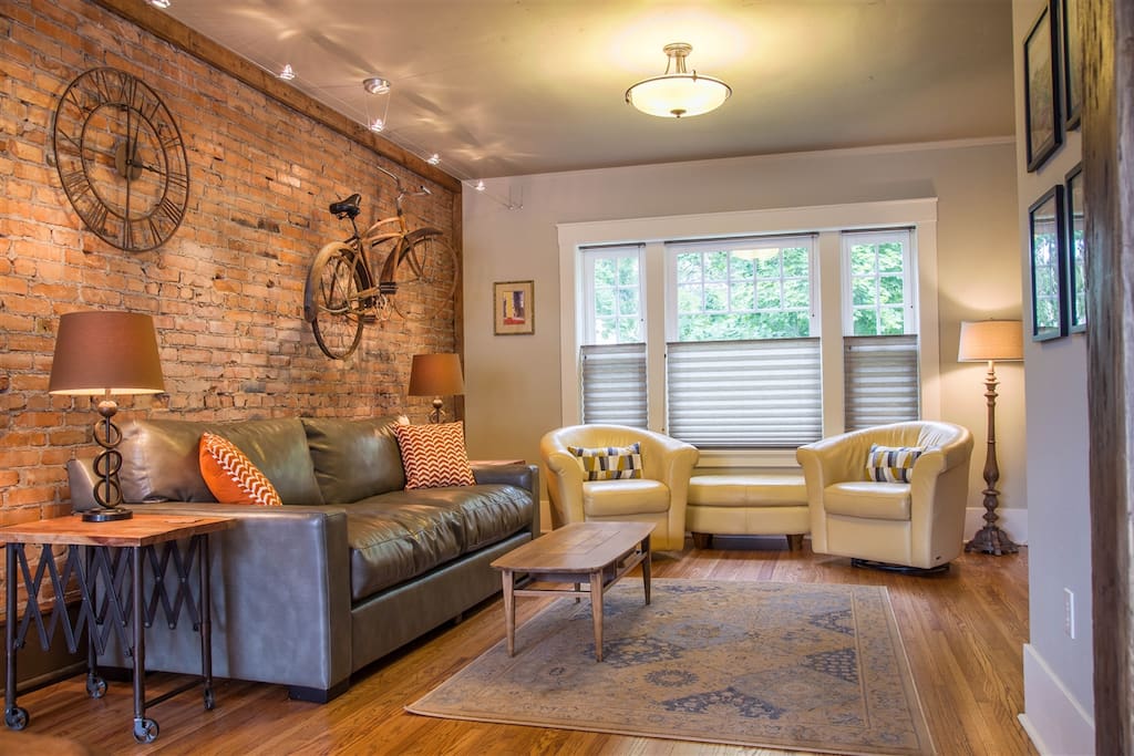 Original brick wall, comfortable seating and flat screen tv with cable.