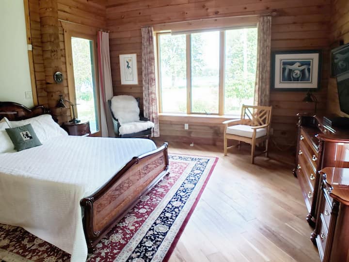 Master bedroom with lake views and en suite bath.